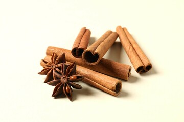 Aromatic cinnamon and anise stars on a color background