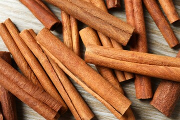 Aromatic cinnamon on a wooden background