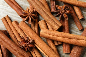 Aromatic cinnamon and anise stars on a wooden background