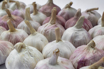 Garlic cloves, Chinese garlic. On white background dry food ingredients. For presentation, food, education, and garlic advertising.