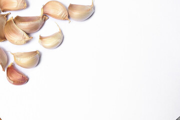 Garlic cloves, Chinese garlic. On white background dry food ingredients. For presentation, food, education, and garlic advertising.