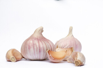Garlic cloves, Chinese garlic. On white background dry food ingredients. For presentation, food, education, and garlic advertising.