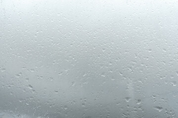 Raindrops on window glass. Rainy weather.