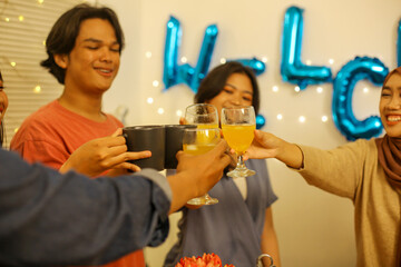 Asian People Toasting Glass Celebrating at Home
