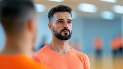 Obraz premium Focused and experienced sports trainer guiding a group of athletes during a skill improvement training session