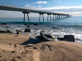 oil bridge in Badalona, ​​photo taken from the right side at the foot of the beach