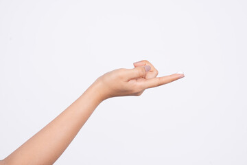 A drop of thick white hand cream on the finger of a woman's hand. Groomed hands on a light background