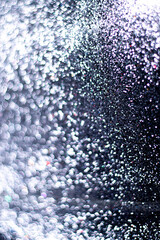 Vector sparkles on a transparent background. Christmas light effect. Sparkling magical dust particles.The dust sparks and golden stars shine with special light.