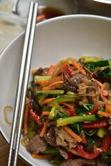 Christmas and New Year's dishes, consisting of meat satay with fried vermicelli and vegetables