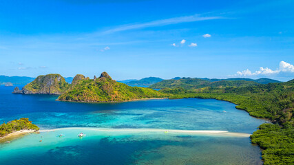 Aerail view of  tropical exotic island sand bar separating sea in two with turquoise  in El Nido,...