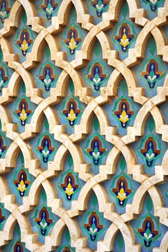 Colorful mosaic repeating pattern with raised stone arched grid