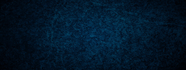 Grunge dark blue rock studio stucco antique grunge spot light backdrop background. concrete distressed gradient limestone sketch wall rough blank aged texture background.
