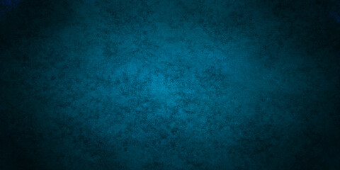 Grunge dark blue rock studio stucco antique grunge spot light backdrop background. concrete distressed gradient limestone sketch wall rough blank aged texture background.