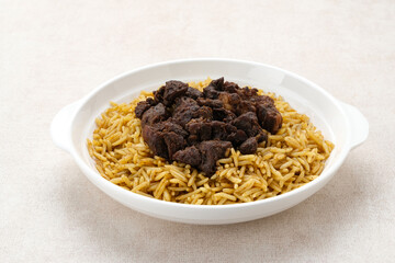 Nasi Kebuli Kambing, Arabian Rice with herb, spices and goat meat topping
