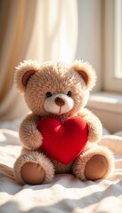 Fluffy teddy bear holding a red heart sitting by the window in a sunlit cozy room