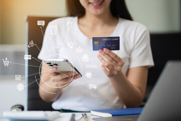 Female businessman use credit cards to conduct financial transactions through phones, tablet, and...