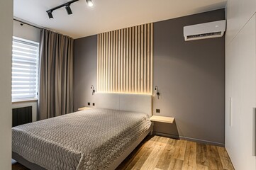 interior room apartment bedroom with bed, cozy place to sleep and relax