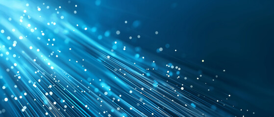 Dynamic blue streaks of light with bokeh effect create a vibrant abstract background.