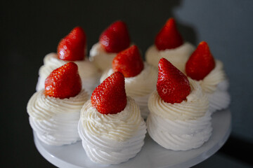 Dessert cupcake cream cheese with strawberries on a dark background