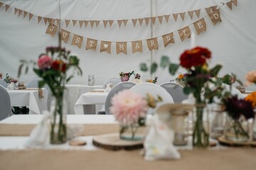 Rustic wedding decor with floral arrangements.
