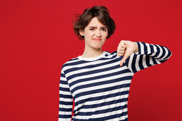 Young sad unhappy disappointed displeased woman she wear blue striped sweatshirt casual clothes...
