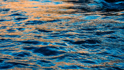Golden Hour Reflection of Sunlight on Rippling Water Surface in Southern Croatia’s Coastal Landscape