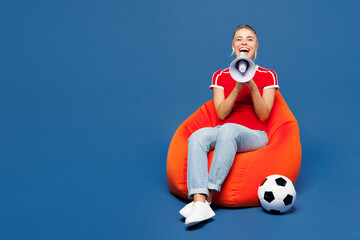 Full body young woman fan wears red t-shirt cheer up support football sport team hold in hand...