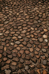 Stone blocks close up. Ancient road paved by a stone block