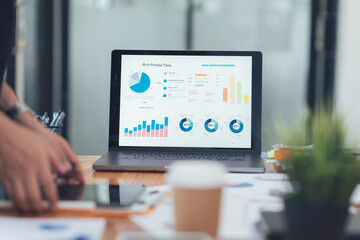Data-Driven Decisions: A close-up view of a laptop screen displaying a comprehensive data...