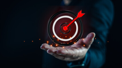 Motivation targets a circular target with an arrow placed precisely in the middle of the target....