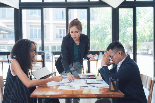 Business Meeting Tension: A serious business meeting unfolds, revealing a tense atmosphere as colleagues grapple with challenges. - Powered by Adobe