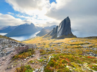Fototapeta premium Stunning autumn landscape of Segla Mountain in Senja Island, Northern Norway, with dramatic cliffs and fjords.