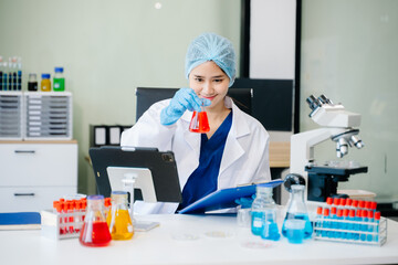 female scientist working with micro pipettes analyzing biochemical