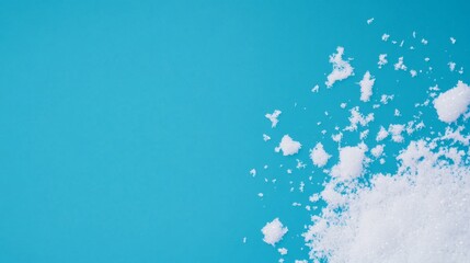 Serene Snowflakes: Minimalist Winter Aesthetic with Crystal-Clear Flakes on Vivid Blue Sky Background