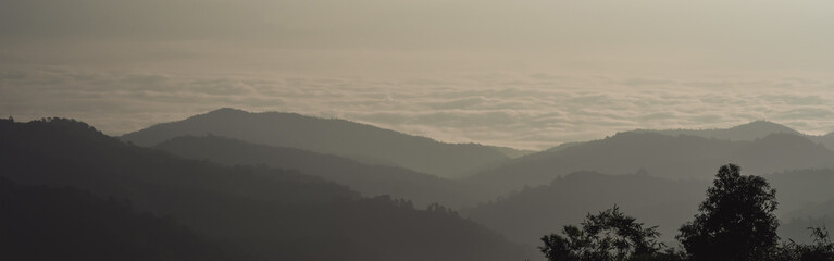 landscape and travel concept with sunrise and layer of mountain and mist with forest on morning