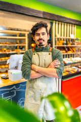 Fototapeta premium Artisan baker standing proud in the shop of new business