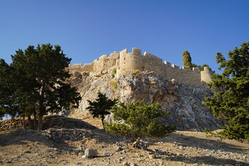 acropolis of lindos on top of the rocky hill