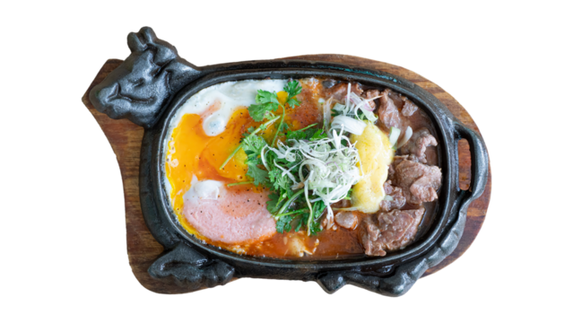 Bo Ne. Vietnamese breakfast. Beef cooked in a hot plate with gravy, eggs and corn which is a westernized. Plate of beef dish in vietnamese