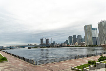 Urban landscape in Tokyo showcasing modern architecture by the river
