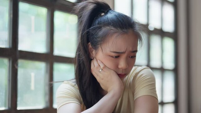 Stressful Asian woman sad of dieting Weight loss fail