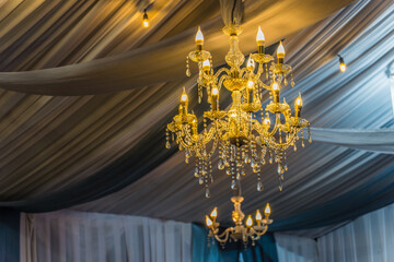 chandelier with crystal glass, Beautiful wedding chandelier decoration on the wedding day, beautiful luxury chandelier in the restaurant, beautiful wedding decoration in the interior.