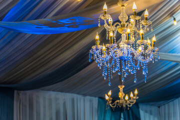 chandelier with crystal glass, Beautiful wedding chandelier decoration on the wedding day, beautiful luxury chandelier in the restaurant, beautiful wedding decoration in the interior.