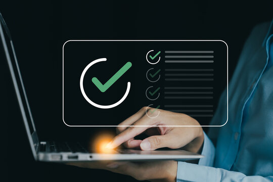 person using laptop with checkmark graphic, symbolizing task completion and productivity. image conveys sense of achievement and efficiency in work