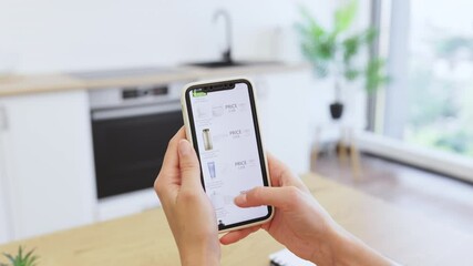 Caucasian woman browsing cosmetics on online store via smartphone. Image captures digital shopping experience, highlighting convenience of purchasing beauty products from home.