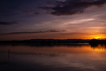 Obraz premium Vysatov pond with sunset color light in autumn sunny evening