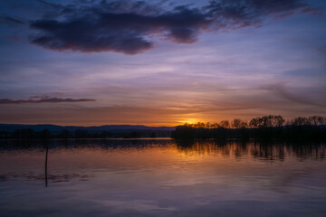 Fototapeta premium Vysatov pond with sunset color light in autumn sunny evening