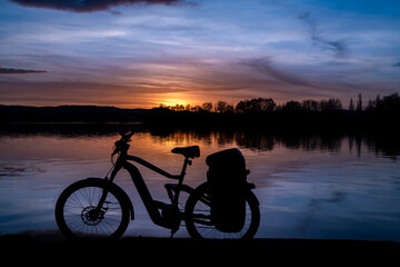 Fototapeta premium Autumn sunset near south Bohemia pond Vysatov with electric bike