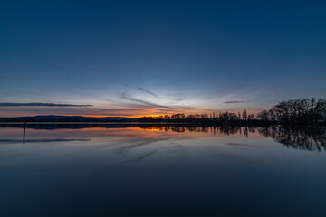 Vysatov pond with sunset color light in autumn sunny evening