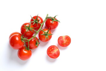 Flat lay composition with fresh cherry tomatoes and basil on white background. Ripe vegetables