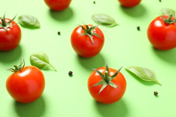 Fresh red tomatoes, pepper and basil on color background, top view
